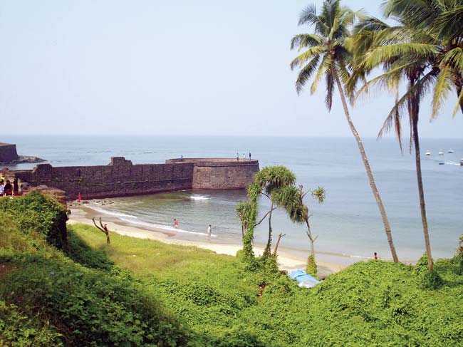 A pier of the Aguada Fort at Sinquerim Beach in Candolim is a vista of green and blue , sugar and spice and everything nice