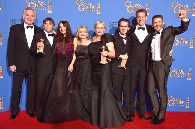 Producer Jonathan Sehring, director Richard Linklater, actress Lorelei Linklater, producer Cathleen Sutherland, actors Patricia Arquette and Ellar Coltrane, producer John Sloss, and actor Ethan Hawke, winners of Best Motion Picture - Drama for 