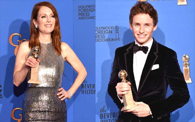 Eddie Redmayne and Julianne Moore pose with their trohpy for Best Performance in a Motion Picture - Drama for 
