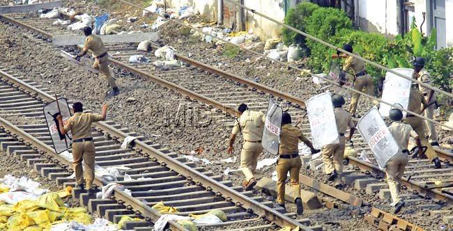 In scenes reminiscent of much bigger riots, policemen could be seen chasing protestors and ordinary commuters down the tracks