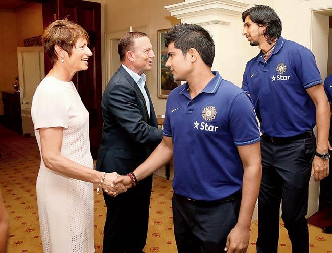 Karn Sharma and Ishant Sharma (right) meet the Australian Prime Minister Tony Abbott and his wife Margaret yesterday