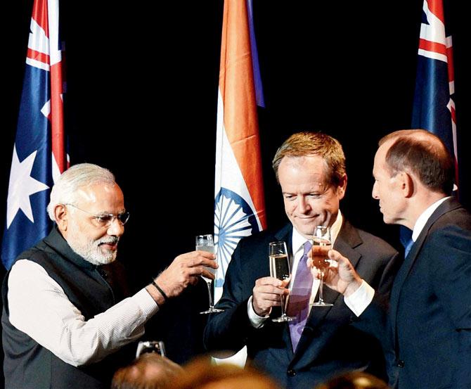 PM Narendra Modi has  visited eight countries including USA, Bhutan, Nepal, Australia, Fiji, Japan, Brazil, and Australia till November 30, 2014. He is seen here with his Australian counterpart, Tony Abbott, and the Australian Leader of  Opposition, Bill Shorten, during a dinner hosted by Abbott in Melbourne, Australia in November  last year. File photo