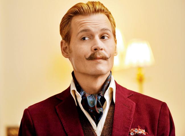 In the name of comedy, you have Johnny Depp making weird faces while twirling his handlebar mustache