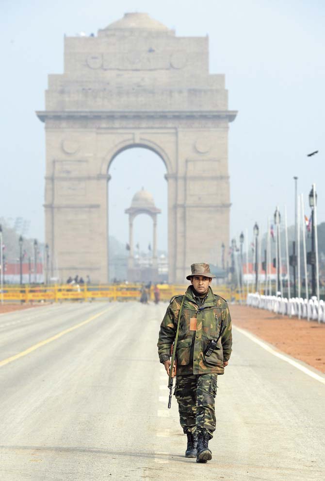 An Indian army personnel patrols the Rajpath a day before Barack Obama’s visit to the capital. Pic/PTI
