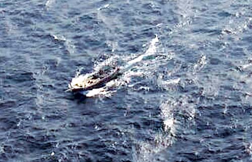 An aerial view of the Pakistani fishing boat that was intercepted by the Indian Coast Guard about 365 km off Porbunder in Gujarat on December 31, 2014. The boat eventually sank after it was blown up by its own crew members. File pic