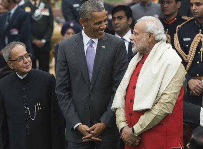 US President Barack Obama (C), Indian Prime Minister Narendra Modi (R) and Indian President Pranab Mukherjee (L). Pic/ AFP