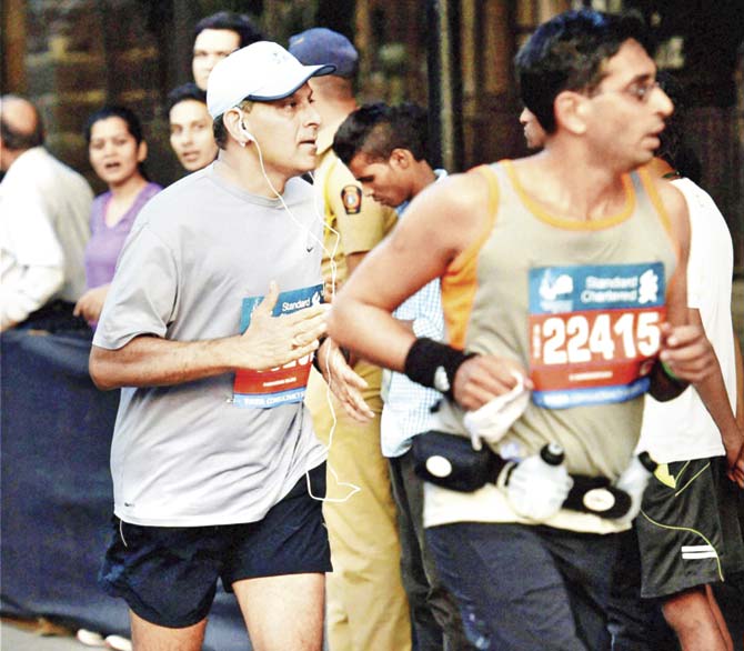 Raghuram Rajan participated in Sunday’s Mumbai marathon; the RBI’s unexpected rate cut gave momentum to activity at Dalal Street. Pic/PTI