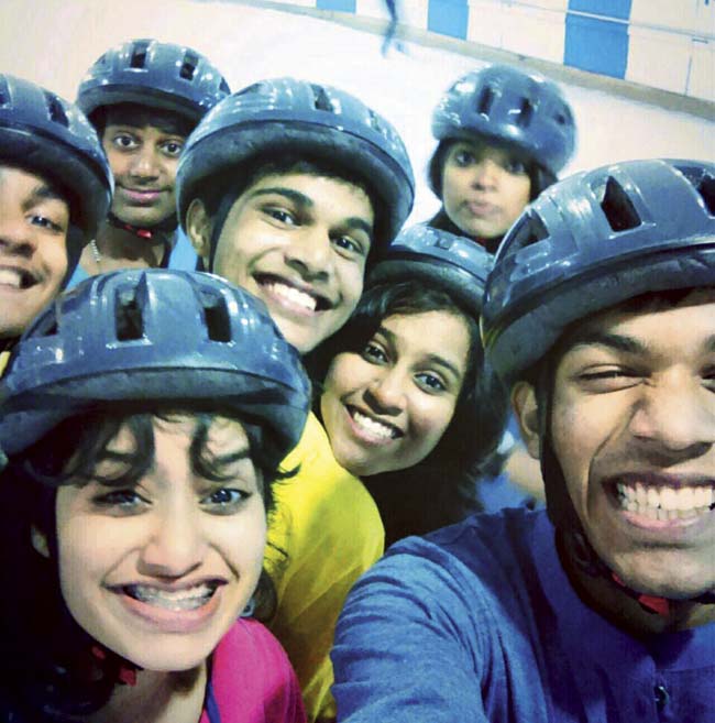 Rayees Shaikh (r) with his friends at the ice skating alley at an amusement park in the city