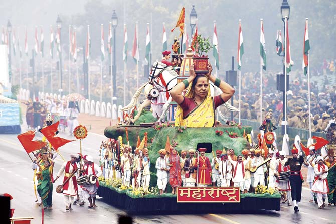 Performers walk alongside a float representing the state of Maharashtra during the Republic Day parade in New Delhi on Monday. What is the purpose of a parade but to make you feel good? It’s about colour and vibrancy and diversity and all those cliches from TV commentators and those general experts on everything. Pic/AFP
