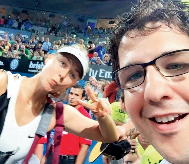 Maria Sharapova poses for a selfie with Australian tennis fan Damian Torrie at the Pat Rafter Arena during the Brisbane International on Tuesday