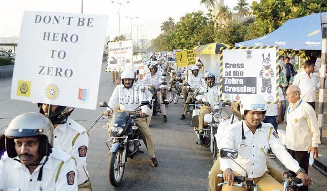 Cops took out a rally from the police gymkhana at Marine Lines, to raise awareness about road safety. Pics/Bipin Kokate