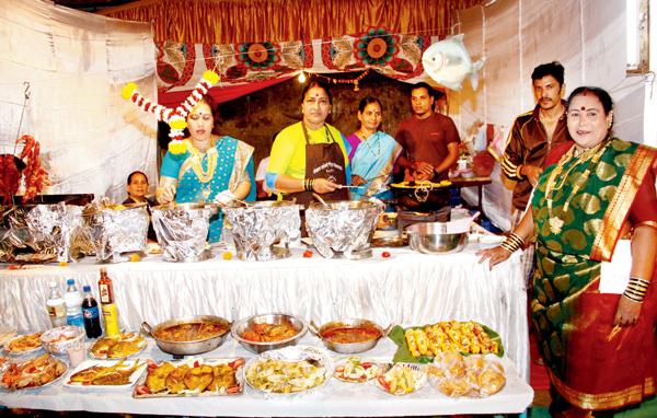 Women serving Koli fare at last year’s edition of the Versova Koli Seafood Festival; (right) Crab Masala and Pomfret Fry