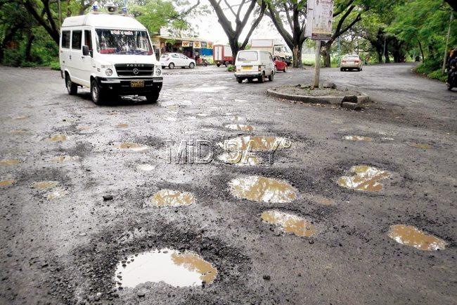 Dark side of the moon: The Aarey Colony road is notorious for  its craters. File pic