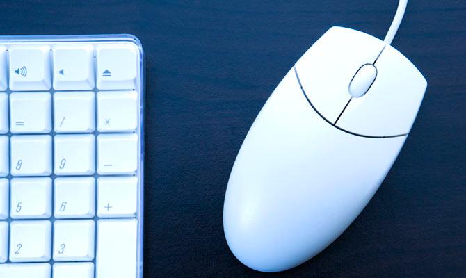 A representational image of a computer mouse next to a keyboard