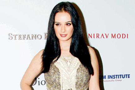 Why was Evelyn Sharma forced to call off a party in her Dubai hotel room? 