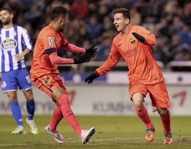 Messi celebrates his hat-trick with teammate Neymar