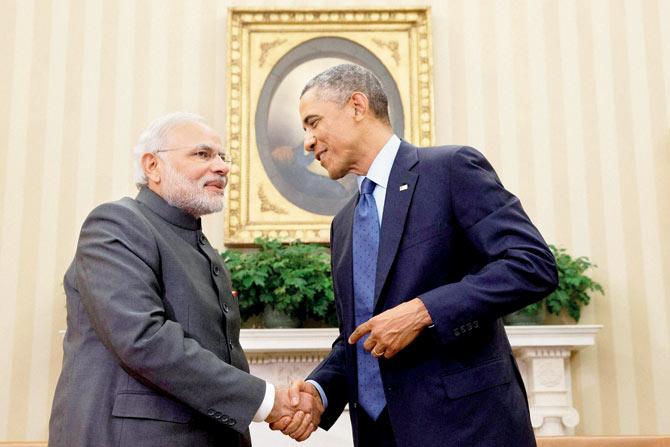 Mansoor Darvesh (below) filed an RTI plea to know the number of foreign visits Modi made between May and November 30, 2014. (Above) PM Modi and US President Barack Obama at the White House in Washington in September 2014