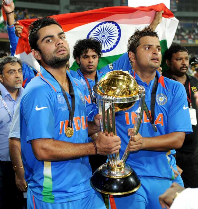 Virat Kohli (left) and Suresh Raina (right) carry the ICC Cricket World Cup trophy after India defeated Sri Lanka in the 2011 final played at The Wankhede Stadium in Mumbai on April 2, 2011.