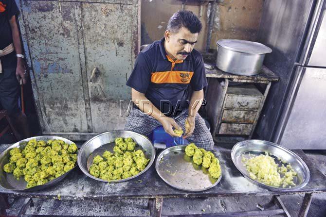 A worker at Babu Vada Pav at Vile Parle rolls the vada. Every three days, they utilise 600 kg of potatoes. pics/khushnum Bhandari