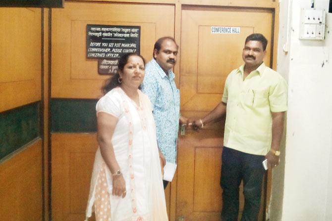 Road rage: (From left) Ratna Mahale and Sunil Ahir of the NCP and Santosh Dhuri of MNS stand outside the conference room of the BMC ward office in which they had locked the three engineers