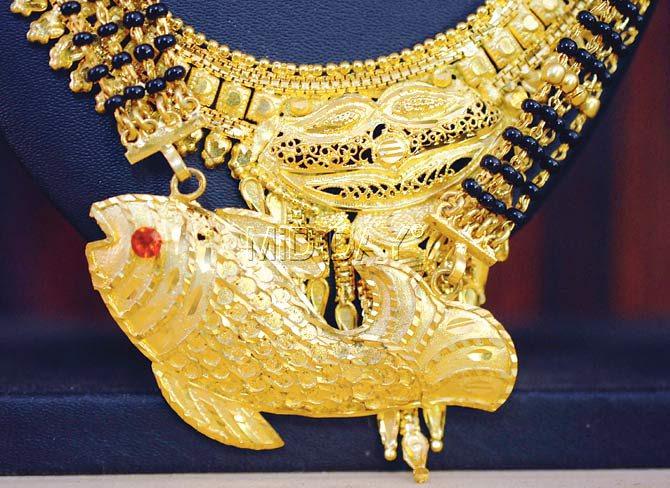 A close-up of a traditional East Indian jewellery showing a fish, reflecting their ties with the sea