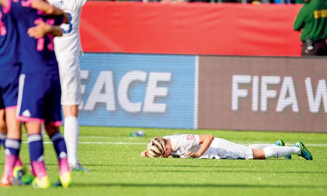 THAT ERROR: England’s Toni Duggan lies on the ground after the final whistle blows in their 2-1 loss to Japan in their FIFA Women’s World Cup semi-final as a late own-goal by defender Laura Bassett put defending champions Japan into the final