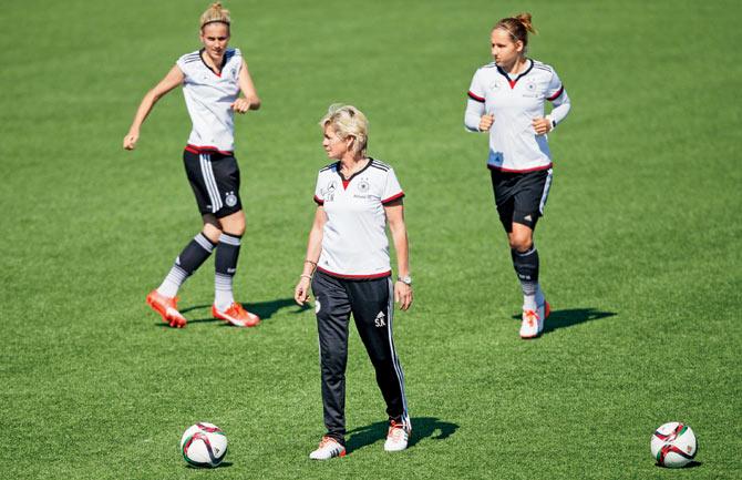 GET SET: German coach Silvia Neid looks on as her players warm up during a training session at the FIFA Women’s World Cup, as Germany meets England tonight in the bronze medal match