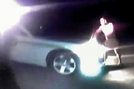 Video shows nude man stealing cop's car and driving away