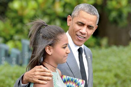 President Obama bonds with his daughters in New York