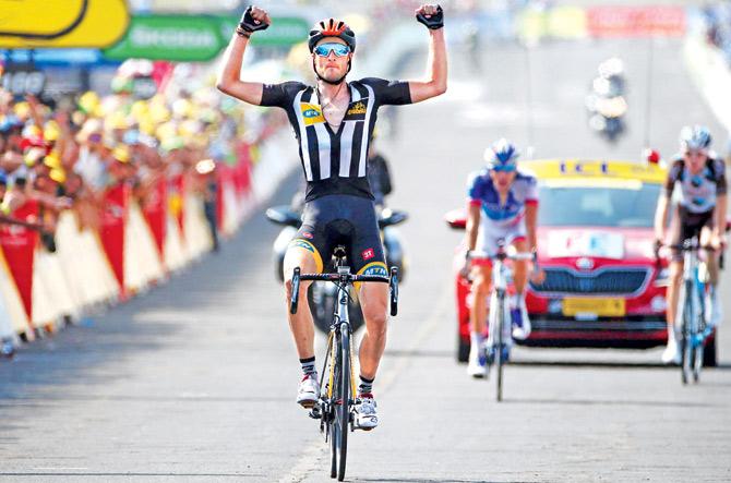 Stephen Cummings celebrates after winning Stage 14 of Tour de France in Mende on Saturday. Pic/Getty Images