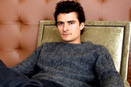 Orlando Bloom gets cosy with a Brazilian actress