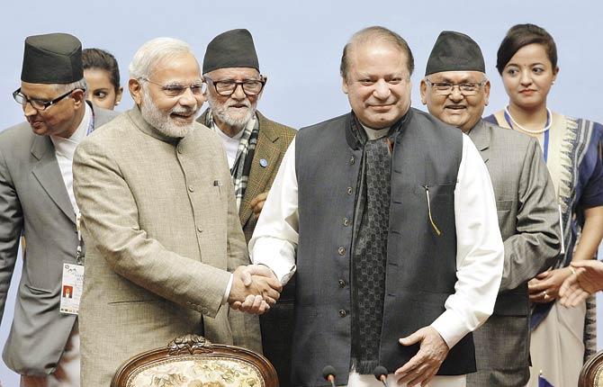 Prime Minister Narendra Modi shakes hands with Pakistan’s Prime Minister Nawaz Sharif at the 18th SAARC summit at Nepal in November, 2014. When the two met again in the Russian city of Ufa about a week ago, expectations soared that the two countries would return to the negotiating table.  Pic/AFP