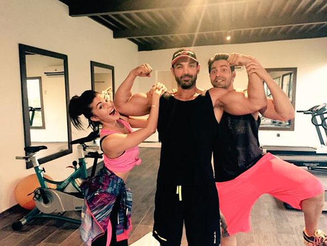 Jacqueline Fernandez, John Abraham and Varun Dhawan strike a pose after their workout session. 