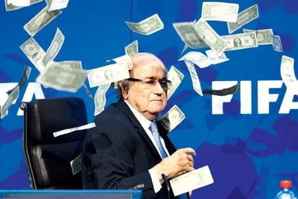 Sepp Blatter showered with fake cash before conference speech
