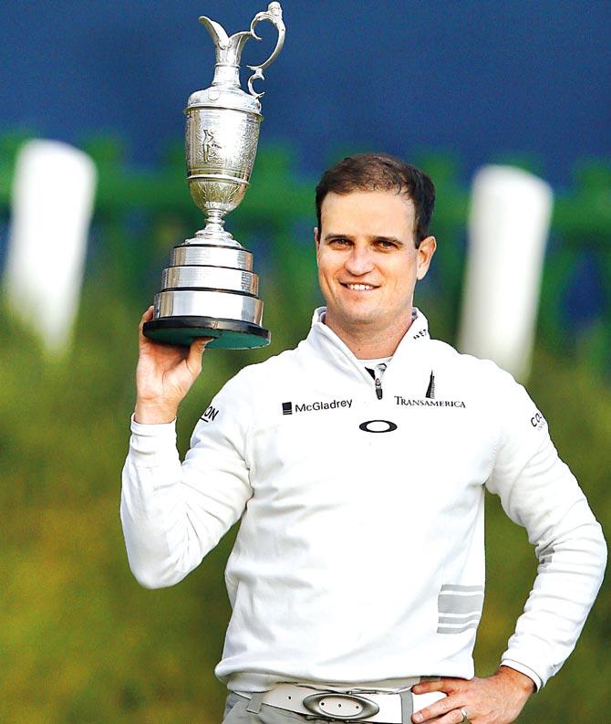 US golfer Zach Johnson with the Claret Jug at the British Open golf championship at St Andrews in Scotland on Monday. Pic/AFP