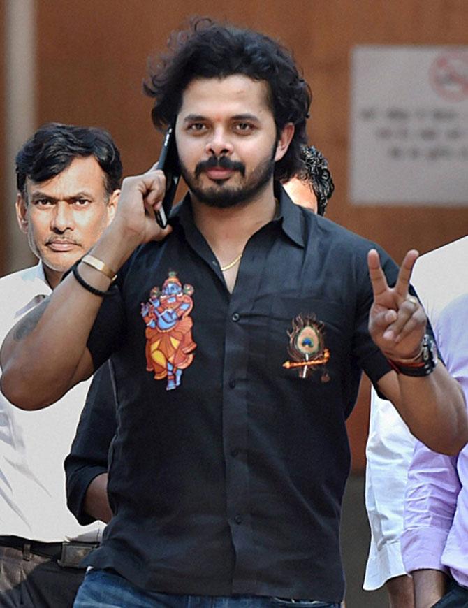 Cricketer S Sreesanth talks on phone outside the Patiala House Courts in New Delhi after a trial court discharged him in the Indian Premier League 2013 spot-fixing scandal on Saturday. Pic/PTI