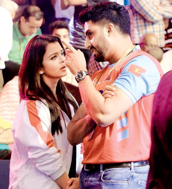 Aishwarya Rai Bachchan listens to hubby Abhishek Bachchan with rapt attention during a Pro Kabaddi League match at the Sawai Mansingh Indoor Stadium in Jaipur on Sunday. Pic/PTI  