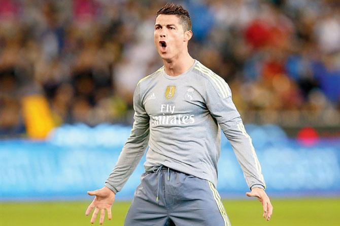 Real’s Ronaldo celebrates after scoring against Man City at the Melbourne Cricket Ground yesterday 