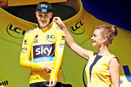Emotional Froome all but wraps up Tour title