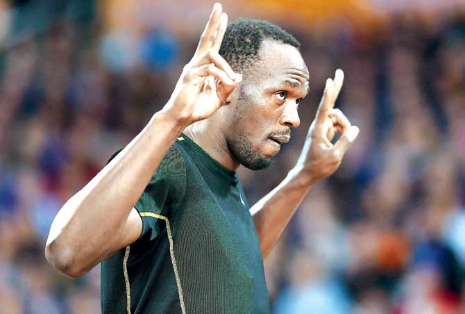 Usain Bolt gestures to the crowd ahead of his 100m race during the London Diamond League on Friday. Pic/Getty Images