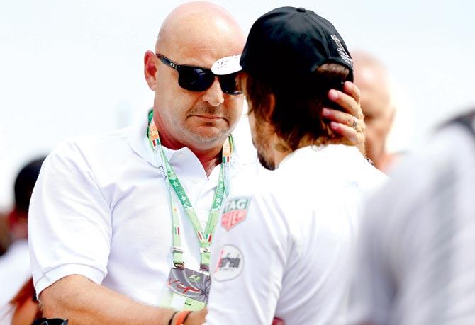 McLaren Honda driver Fernando Alonso comforts Jules Bianchi