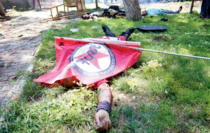 GORY STORY: This photo shows bodies on the ground after an explosion in the town of Suruc, on July 20, 2015, not far from the Syrian border. At least 20 people were killed and dozens injured, with the origin of the explosion not immediately determined, but many authorities and Turkish media claiming the attack to be carried out by a suicide bomber