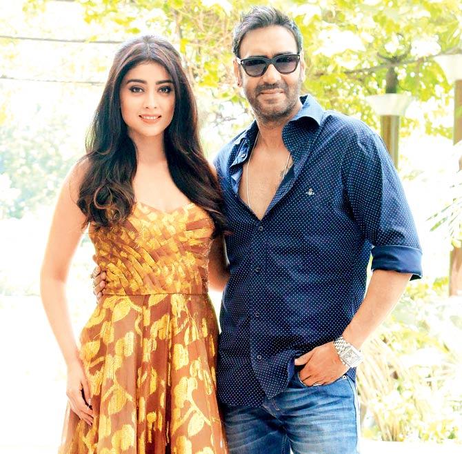 Shriya Saran (left) and Ajay Devgn at a promotional event for Drishyam in Delhi on Tuesday. pic/yogen shah