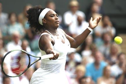 Wimbmledon: Ice-cool Serena defies heat to make third round