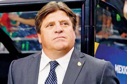 Mexico coach Miguel Herrera sacked for punching journalist
