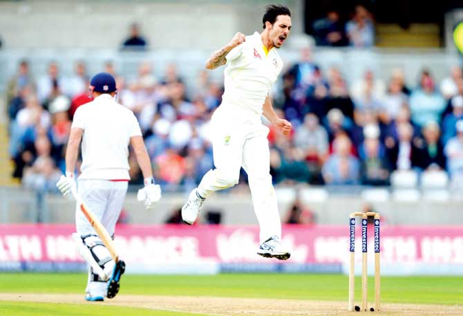 Mitchell Johnson celebrates his 300th Test wicket after dismissing England