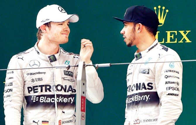 Nico Rosberg and Lewis Hamilton (right). Pic/AFP