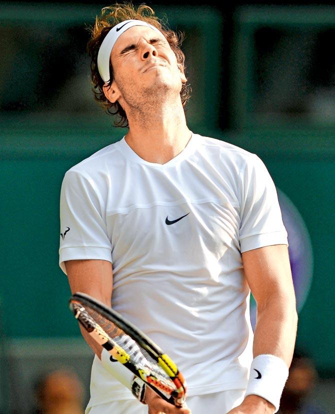 Rafael Nadal reacts after dropping a point against  Dustin Brown during their second round match on Thursday at the All England Tennis Club in Wimbledon. Pic/AFP