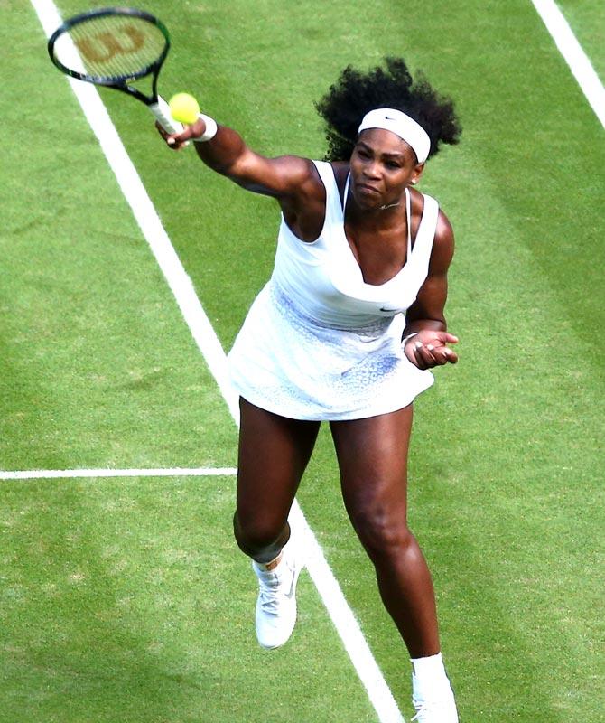 US player Serena Williams smashes a return against Britain