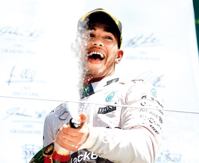 Lewis Hamilton celebrates winning the British GP yesterday. Pic/Getty Images